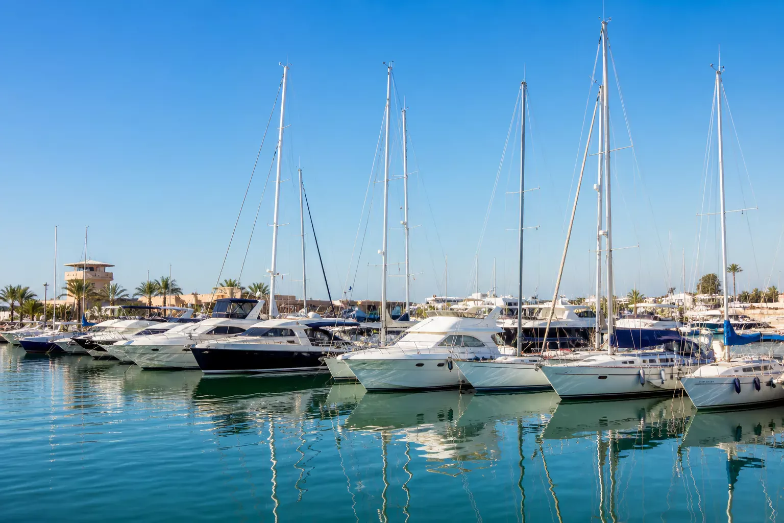 Boats and yachts in sunny harbor